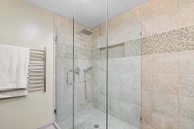 bathroom with radiator heating unit and walk in shower