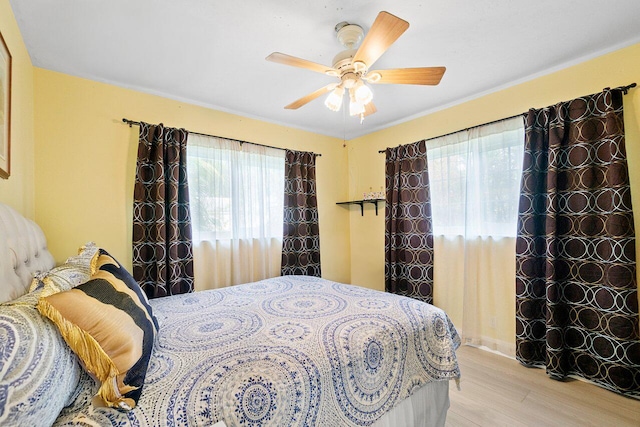 bedroom featuring ceiling fan and light hardwood / wood-style floors