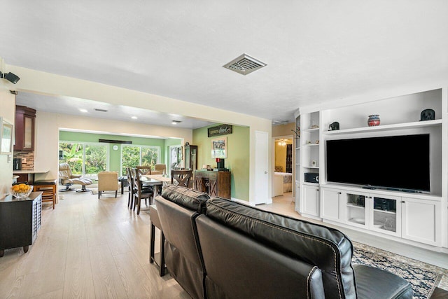 living room with light hardwood / wood-style floors