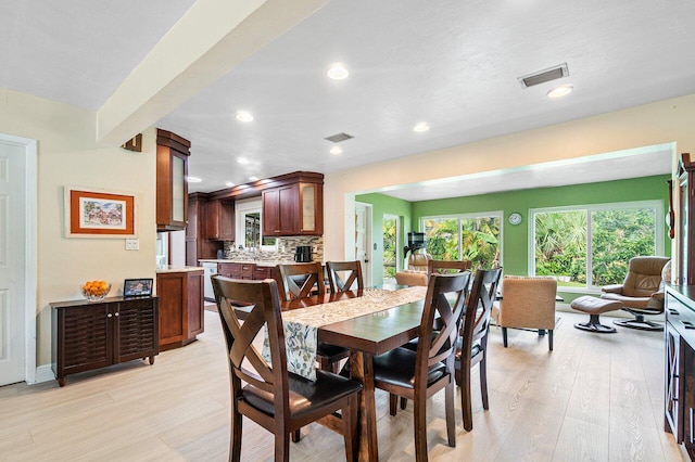 dining area with light hardwood / wood-style floors