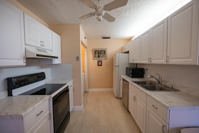 kitchen featuring black appliances, sink, light hardwood / wood-style flooring, a textured ceiling, and white cabinetry