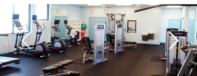 exercise room with ceiling fan