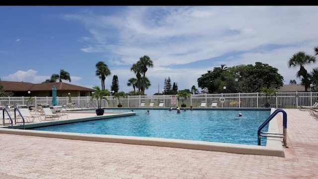 view of pool featuring a patio