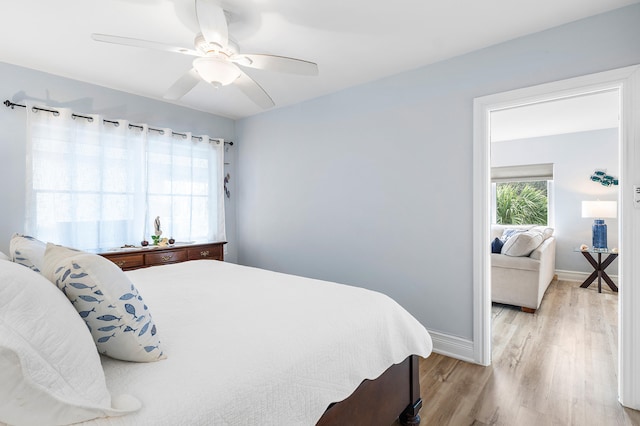 bedroom featuring ceiling fan and light hardwood / wood-style floors