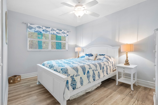 bedroom featuring ceiling fan and light hardwood / wood-style flooring