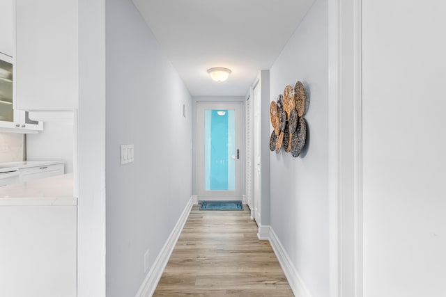 hall with light hardwood / wood-style floors