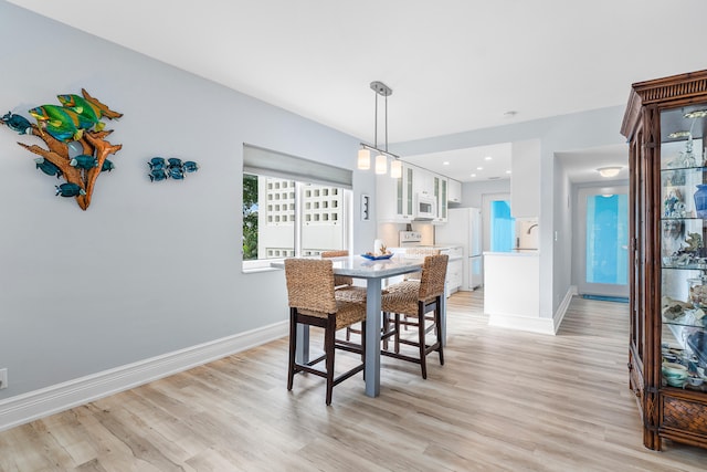 dining space featuring light hardwood / wood-style floors