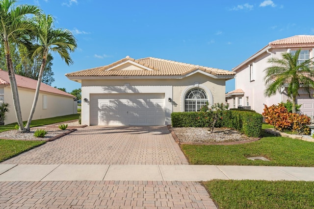 mediterranean / spanish-style house featuring a garage