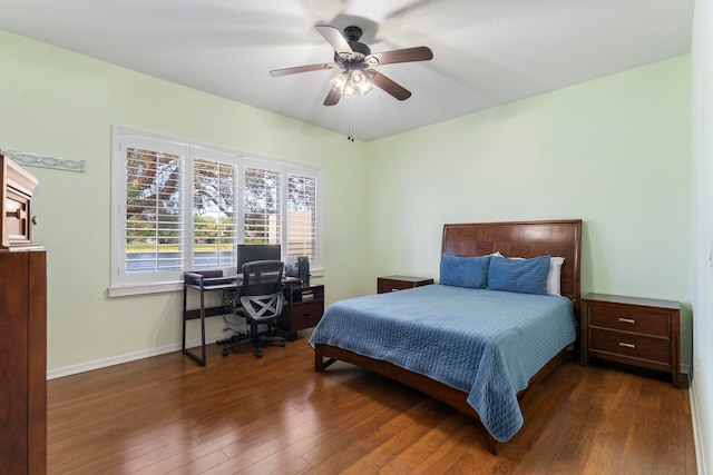 bedroom featuring ceiling fan and dark hardwood / wood-style floors