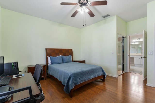 bedroom with ceiling fan, dark hardwood / wood-style flooring, and ensuite bathroom