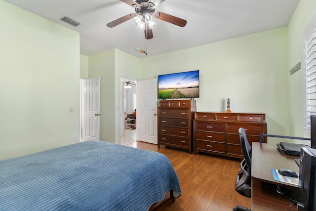 bedroom with ceiling fan and wood-type flooring