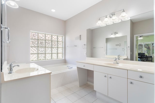 bathroom featuring a wealth of natural light, tile patterned flooring, and vanity