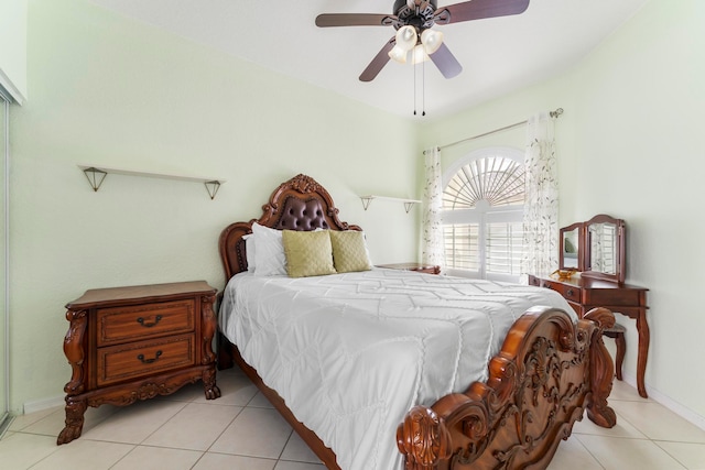 tiled bedroom with ceiling fan