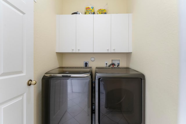 laundry room featuring cabinets and independent washer and dryer