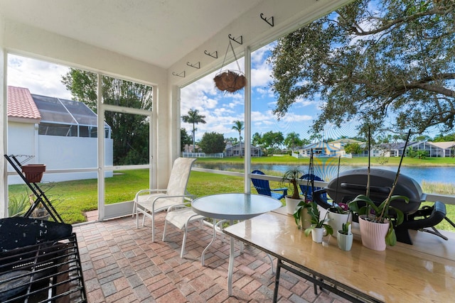 sunroom with a water view