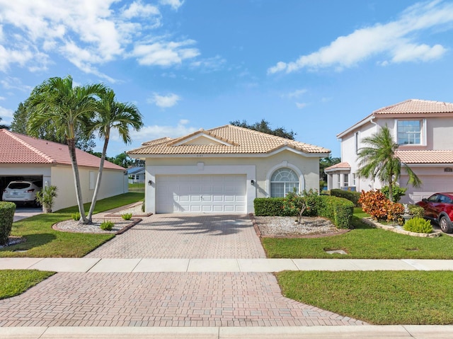 mediterranean / spanish-style house with a front yard