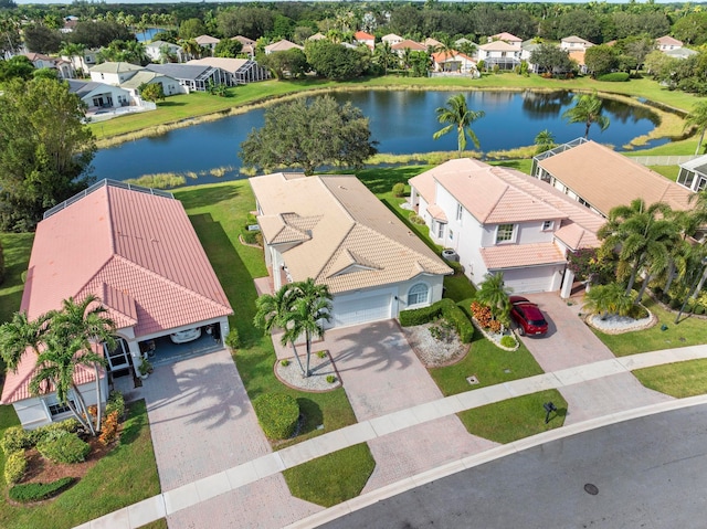 birds eye view of property with a water view