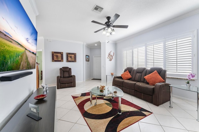 tiled living room with ceiling fan and ornamental molding