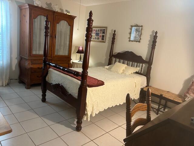 bedroom with light tile patterned flooring