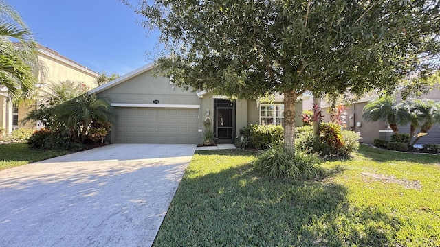 view of front of property with a garage and a front yard