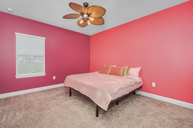 carpeted bedroom featuring ceiling fan