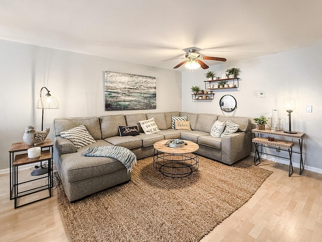 living room featuring hardwood / wood-style flooring and ceiling fan