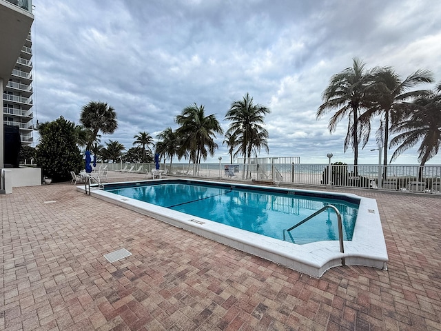 view of swimming pool featuring a patio