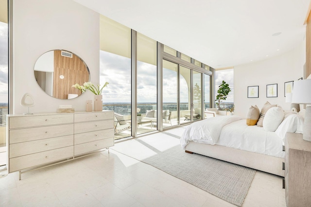 bedroom with access to outside and floor to ceiling windows