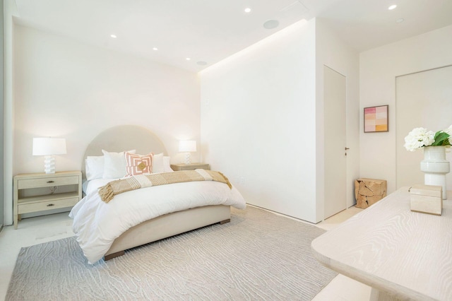 bedroom featuring light colored carpet