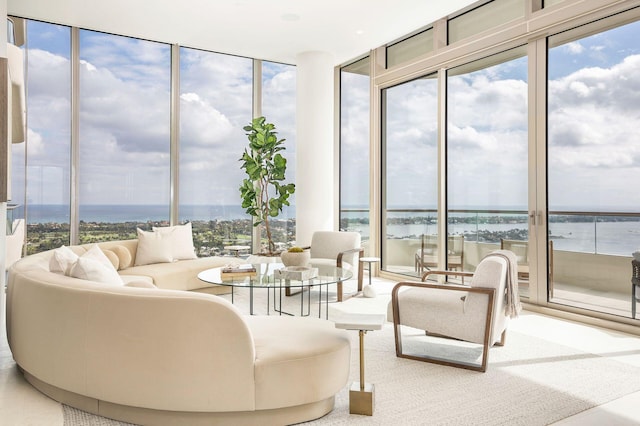 sunroom with a wealth of natural light and a water view