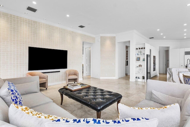 living room featuring built in shelves and ornamental molding