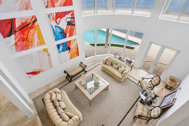 living room featuring a high ceiling