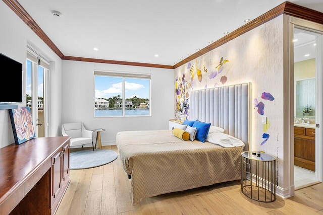 bedroom with ensuite bath, crown molding, a water view, and light hardwood / wood-style floors