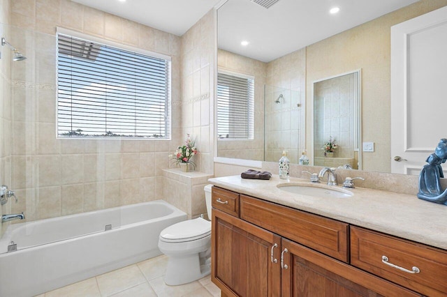 full bathroom with tile patterned flooring, vanity, toilet, and a wealth of natural light