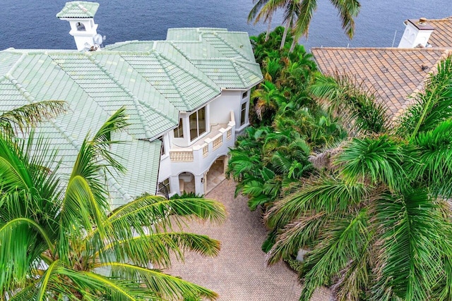 birds eye view of property with a water view