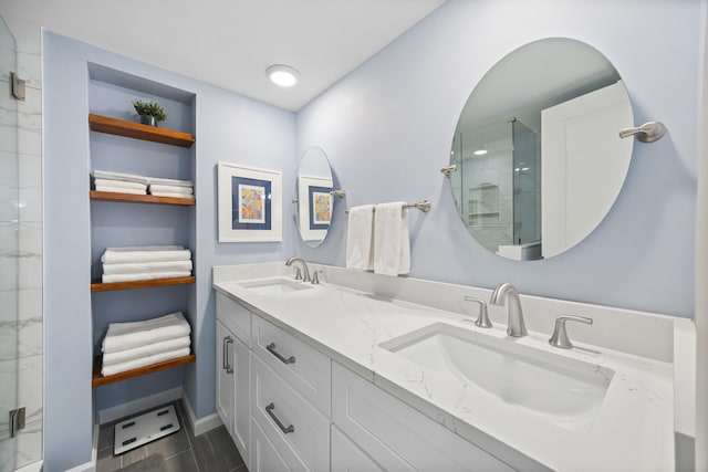 bathroom featuring vanity and a shower with door