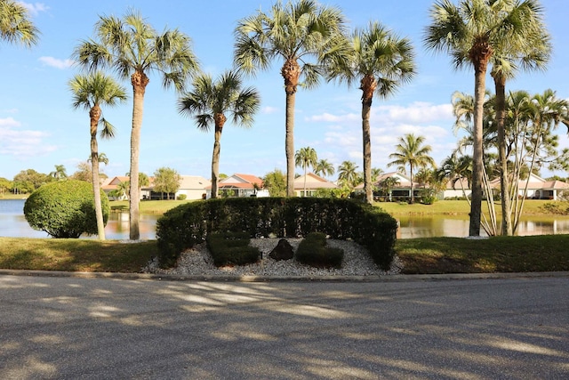 community sign featuring a water view