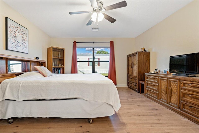 bedroom featuring ceiling fan and light hardwood / wood-style flooring