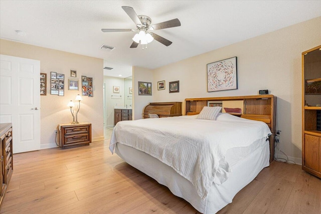 bedroom with connected bathroom, ceiling fan, and light hardwood / wood-style floors