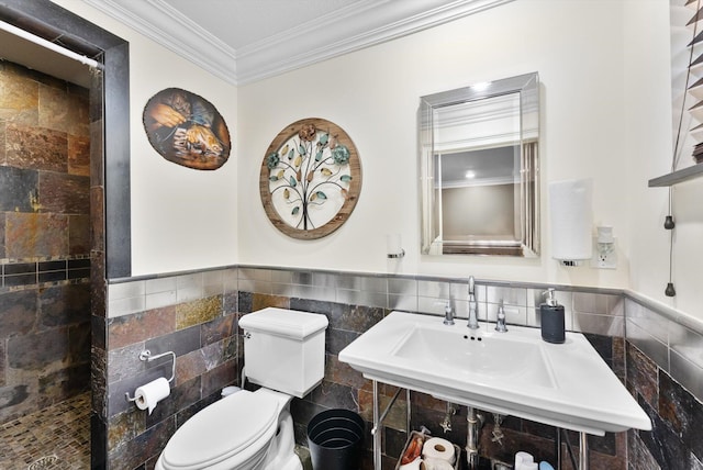 bathroom with toilet, crown molding, walk in shower, and tile walls