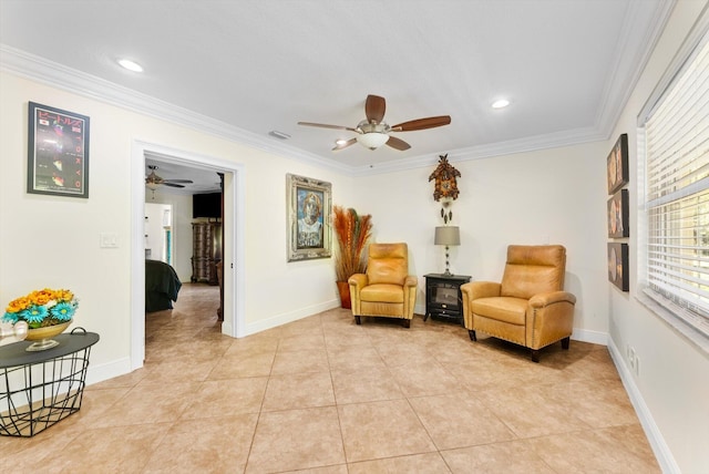 sitting room featuring light tile patterned floors and ornamental molding