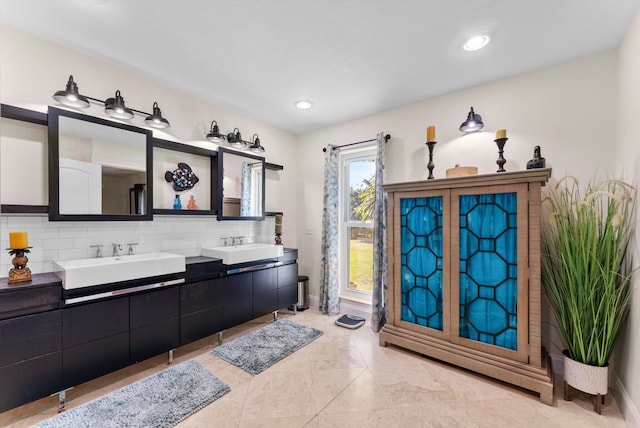 bathroom featuring decorative backsplash, vanity, and tile patterned floors