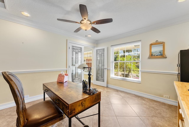 tiled home office with ceiling fan, french doors, a textured ceiling, and ornamental molding