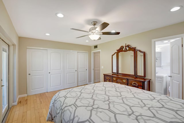 bedroom featuring ceiling fan, light hardwood / wood-style floors, connected bathroom, and a closet