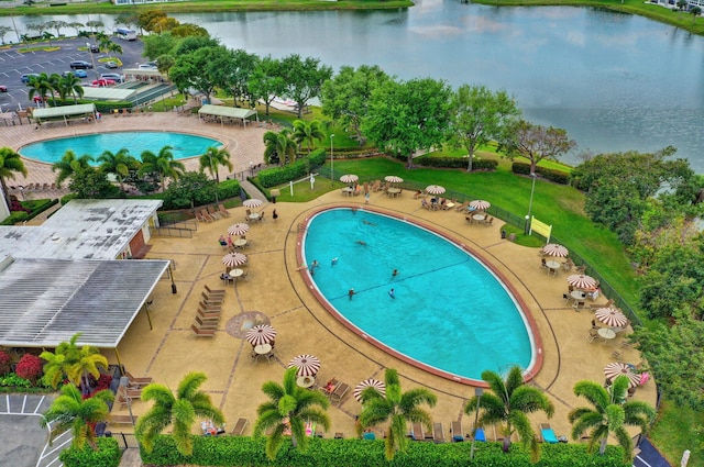 view of pool with a water view