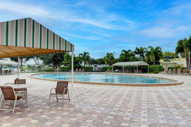 view of swimming pool with a gazebo and a patio area