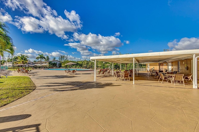 view of property's community with a patio and a swimming pool