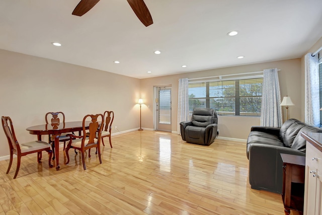 dining area featuring ceiling fan and light wood-type flooring