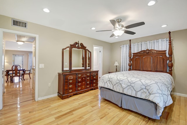 bedroom with light hardwood / wood-style flooring and ceiling fan