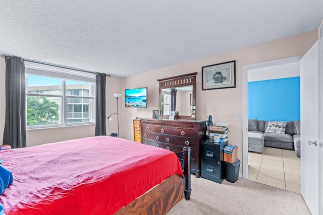 carpeted bedroom with a textured ceiling